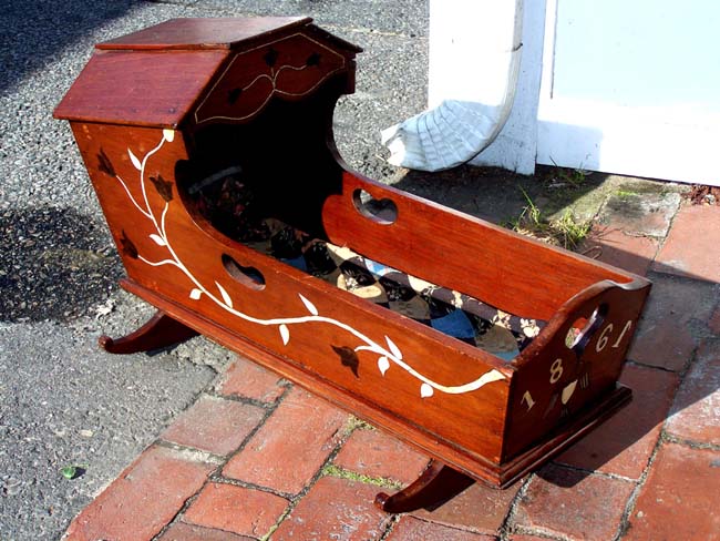 A Fine and Rare 19th century ANTIQUE SCRIMSHAW Sailor-made Child's or Doll's Cradle with whalebone inlays and dated 1861.